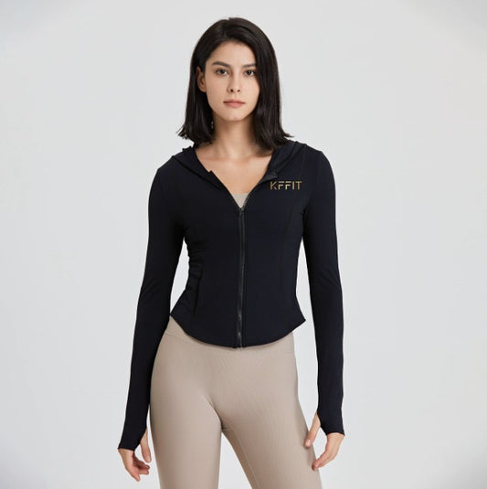 Long sleeve luxe top by KFFIT in soft fabric, shown in a neutral color, featuring a relaxed fit and subtle design details.